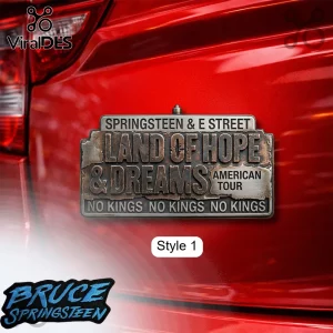 Distressed metal emblem with text Springsteen & E Street Land of Hope & Dreams American Tour No Kings on a red car!