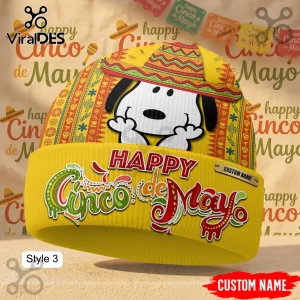 A yellow custom beanie with Snoopy in a sombrero and the text 'Happy Cinco de Mayo' in red, green, and white lettering!