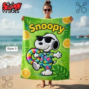 Lime green beach towel with Snoopy in sunglasses and a Hawaiian shirt, holding a rainbow floatie with text 'Snoopy'!