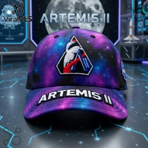 Artemis II galaxy print hat in purple and blue with embroidered astronaut patch and text 'ARTEMIS II' on the visor!