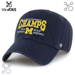 Navy blue championship hat with yellow 'CHAMPS' and 'M' text, plus white 'MEN'S NATIONAL 2026 DIVISION I NCAA BASKETBALL'!