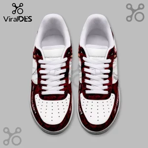 White sneakers with a dark red rose pattern and the text 