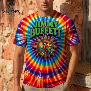 Vibrant rainbow tie-dye t-shirt with green JIMMY BUFFETT text above a tropical parrot wearing a sombrero drinking a cocktail!