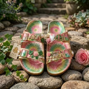 AKA adorned tie-dye sandals featuring pink, green, yellow swirls, roses, ivy, pearls, a scroll, glove, and shield emblems!