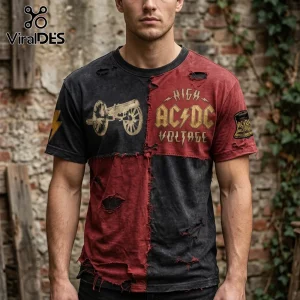 Distressed patchwork t-shirt in washed black and red! Features gold AC/DC HIGH VOLTAGE text, cannon, and lightning bolt graphics!