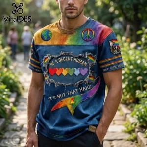 Blue distressed denim style t-shirt with rainbow hearts, peace sign, earth, and text Be A Decent Human It Is Not That Hard!