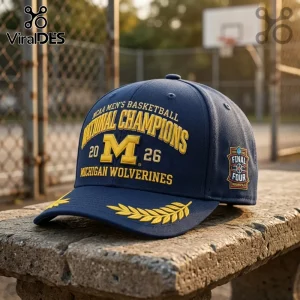 Navy blue baseball cap with yellow embroidery reading NCAA Men's Basketball National Champions 2026 Michigan Wolverines!