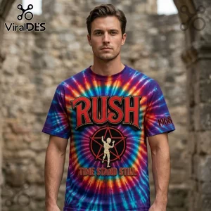 Man wearing tie-dye Rush t-shirt with red text RUSH, 1968, and Time Stand Still with starman logo on blue and red base!