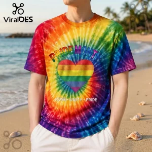 Colorful rainbow tie-dye t-shirt with PRIDE MONTH text and a heart icon over a beach background!