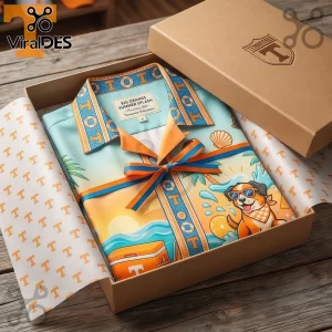 Folded button-down shirt with Big Orange Summer Splash text, dog illustration, and orange coastal theme in gift box!