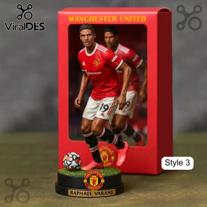 Manchester United Raphael Varane soccer figurine! Red jersey with 'TeamViewer' and '19', white shorts, black base, green turf!