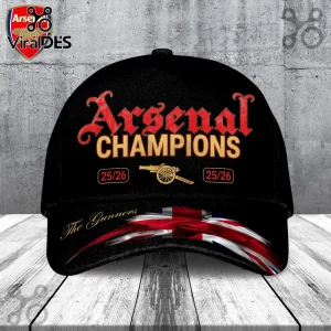Black baseball cap featuring Arsenal Champions 25/26 text, cannon graphic, and UK flag detail on the brim!