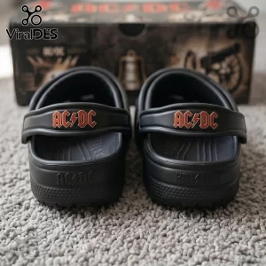 Black Crocs clogs featuring red AC/DC logo with lightning bolt and embossed HELL/BELLS text! Hard rock band merchandise footwear!