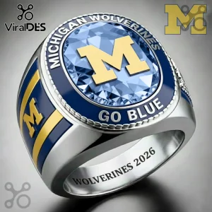 Michigan Wolverines championship ring with blue gem and gold M logo featuring GO BLUE and WOLVERINES 2026 text!