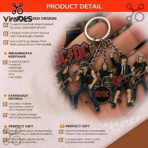 Silver keychain with red AC/DC logo charm and five colorful cartoon band members playing instruments! Rock band fan art style!