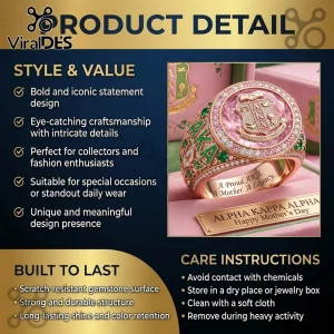 Rose gold Alpha Kappa Alpha ring with a pink central stone, green and clear gems, AKA emblem, and