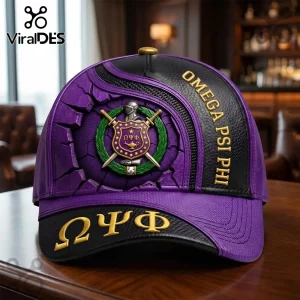 Purple and black baseball cap with Omega Psi Phi crest, gold Greek letters, and 3D cracked wall effect.!