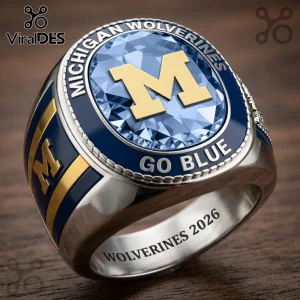 Michigan Wolverines championship style ring with blue stone, gold M logo, and text Michigan Wolverines Go Blue 2026!