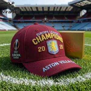 Maroon baseball cap with embroidered Europa League Champions 2026 and Aston Villa logo on soccer pitch field background!