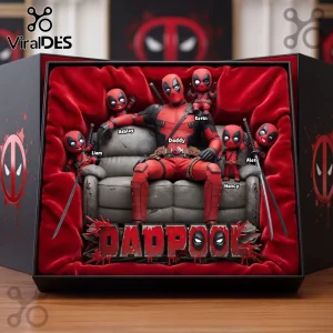 Deadpool and mini Deadpool figures on a couch in a velvet-lined box, 