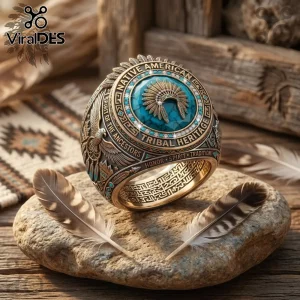 Gold Native American heritage ring with turquoise center and headdress engraving on stone background with feathers!