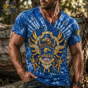 Blue tie-dye distressed V-neck tee, vintage style eagle graphic. Text: EST. 1986, ESTABLISHED, TRADITION, WEST COAST EAGLES, AFL PREMIERS!