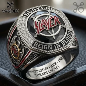 Slayer band commemorative ring featuring a red Slayer logo, black stone, and engraved text Reign in Blood on metal.!