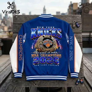 New York Knicks 2026 NBA Champions varsity jacket with blue and orange graphic design featuring a championship ring.!