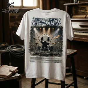 White t-shirt featuring Snoopy drumming on stage under spotlights with dark musical notations and abstract borders.!