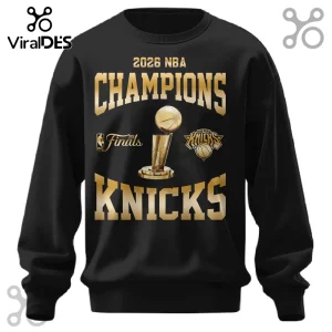 Black crewneck sweatshirt with gold graphic text reading 2026 NBA Champions Knicks and Larry O'Brien trophy illustration.!