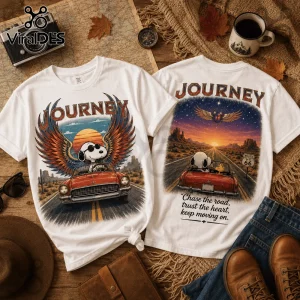 Two white cotton t-shirts with Snoopy graphic driving a red car on a desert road with Route 66 and Journey text motifs.!