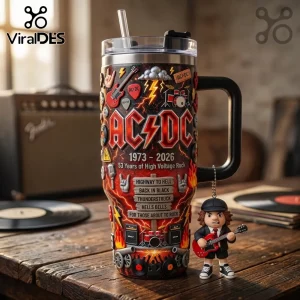 AC/DC stainless steel tumbler with 3D band elements, lightning, guitars, and song titles on a wooden table with a figure.!