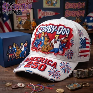 White distressed baseball cap featuring Scooby-Doo characters, American flag patches, and red text reading America 250.!
