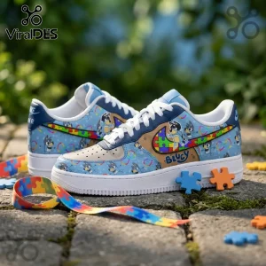 Custom Bluey Nike Air Force 1 sneakers with puzzle piece swoosh designs on a stone background with ribbon and pieces.!