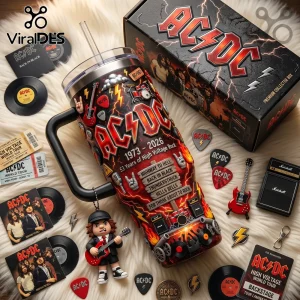 AC/DC 1973-2026 stainless steel tumbler with 3D band elements, lightning patterns, song titles, and a dangling guitar figure.!