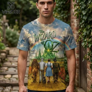 Wizard of Oz full-print t-shirt showing Dorothy, Tin Man, Scarecrow, and Lion walking on yellow brick road to Emerald City.!