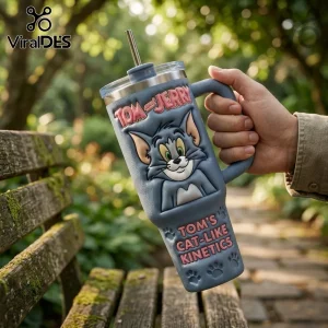 Blue insulated stainless steel tumbler with a 3D Tom and Jerry character relief and text reading Tom's cat-like kinetics.!