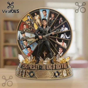 Elvis Presley collectible statue with black leather outfit and guitar in front of a wheel featuring multiple portraits.!