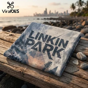 Linkin Park graphic blanket with geometric blue and white patterns on a wooden beach pier with coastal city backdrop.!