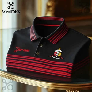 Black polo shirt with red stripes on collar and waist, Kappa Alpha Psi crest on chest, and red embroidered Your name text.!
