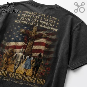 Wizard of Oz characters and a wooden cross printed on a black vintage-wash t-shirt with American flag background.!