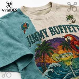 Jimmy Buffett graphic t-shirt with teal and cream split panels, featuring parrot, palm tree, and margarita illustrations.!
