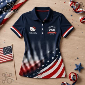 Navy blue polo shirt with Hello Kitty logo and 250 Years of Freedom 1776-2026 text over American flag graphic print.!
