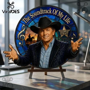 George Strait round glass plaque reading The Soundtrack Of My Life with cowboy imagery on a wooden display stand.!
