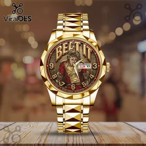 Gold-toned wristwatch featuring Michael Jackson in his Beat It outfit, with bold numerals and a date display on the dial.!