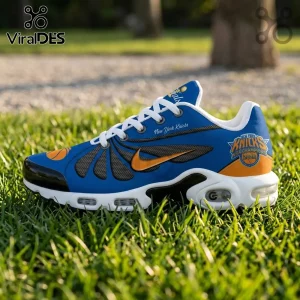 New York Knicks 2023 NBA Champions blue and orange running shoe with white laces and black mesh accents on green grass.!