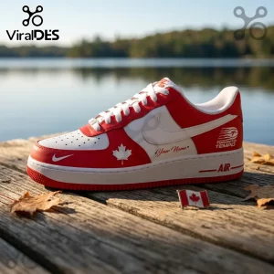 Custom red and white leather sneaker with Canadian maple leaf icon and Toronto Tempo text on a wooden dock by a lake.!