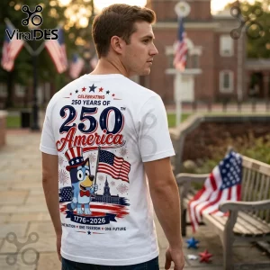 Man wearing a white t-shirt featuring Bluey holding a US flag with the text 250 Years of America 1776-2026.!
