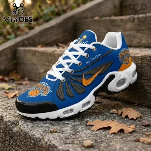 New York Knicks basketball sneaker featuring blue, orange, and white panels with team logos on a stone step background.!
