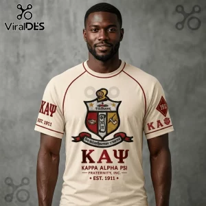 Man wearing a cream-colored Kappa Alpha Psi fraternity t-shirt with crimson logo graphics and text on a gray background.!